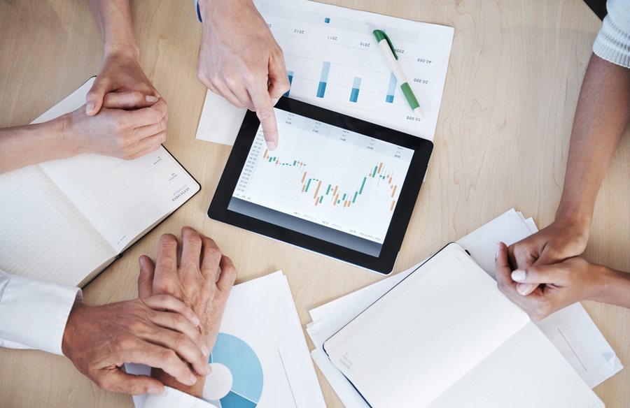 Team reviewing financial data on a tablet