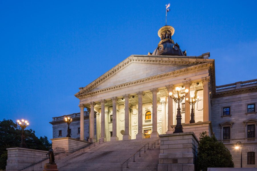 Historic courthouse illuminated at dusk