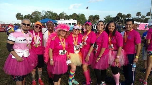 Brock & Scott employees and family in pink race gear on the course in Coral Springs